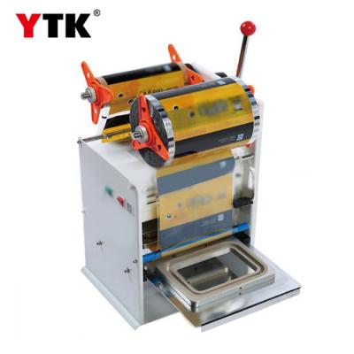 Aluminum box aluminum foil box sealing machine instant noodle box sealing machine small pot tea sealing machine yogurt cup sealing cup machine